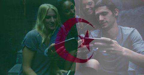 Group sharing smartphones and tablet on steps with crescent-star overlay, moody cinematic