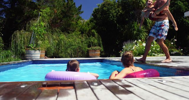 Family Enjoying Poolside Fun in Backyard Garden - Download Free Stock Images Pikwizard.com