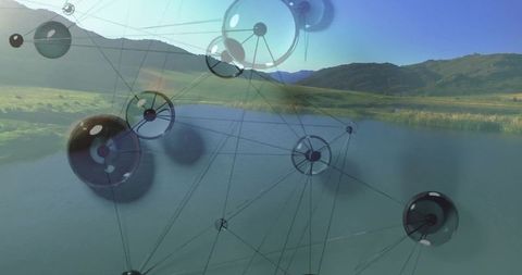 Translucent spheres form digital network over scenic lake valley