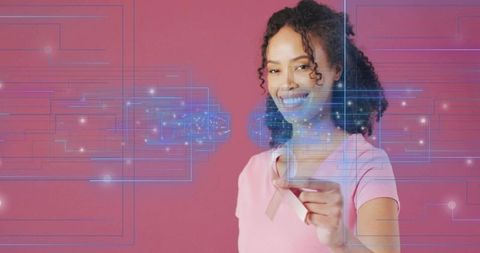 African American Woman Holding Pink Ribbon with Digital Health Overlay for Empowerment