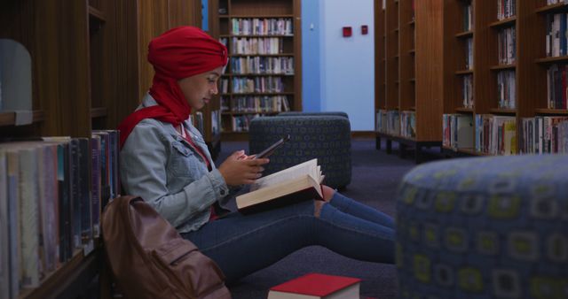 Young Woman with Red Hijab Studying in Library Using Smartphone - Download Free Stock Images Pikwizard.com