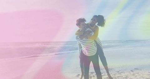Couple Enjoying Playful Piggyback Ride on Sunny Day at Beach
