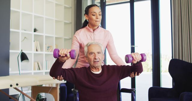 Senior Man Exercising with Trainer at Home for Rehabilitation - Download Free Stock Images Pikwizard.com