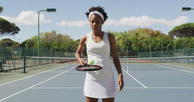 Young Woman Concentrating While Playing Tennis on Outdoor Court - Download Free Stock Images Pikwizard.com