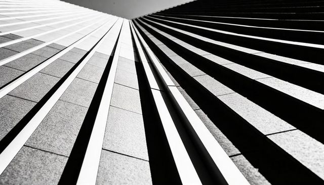 Abstract Monochrome Vertical Facade Rising Toward Vanishing Point with Strong Shadow Lines