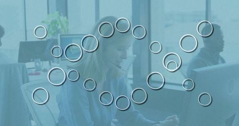 Women collaborating in tech-driven office