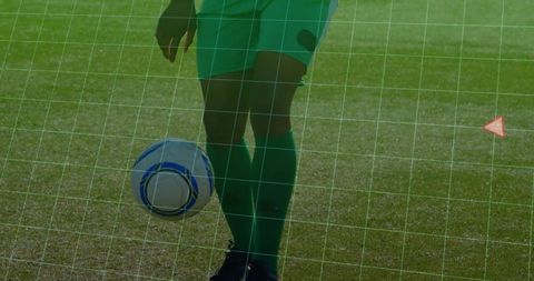 Soccer player dribbling across field with ball controlled near cleats