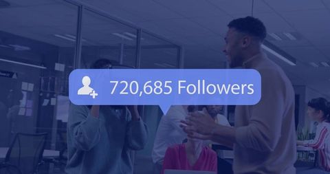 Young team collaborating in modern office with social media followers notification overlay