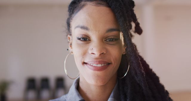 Confident Black Woman Smiling at Camera with Braided Hair - Download Free Stock Photos Pikwizard.com