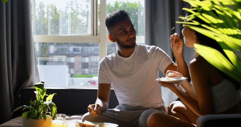 Young Asian Couple Dining Together in Sunlit Living Room - Download Free Stock Images Pikwizard.com