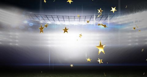 Golden Stars Twirling in Illuminated Stadium Arena