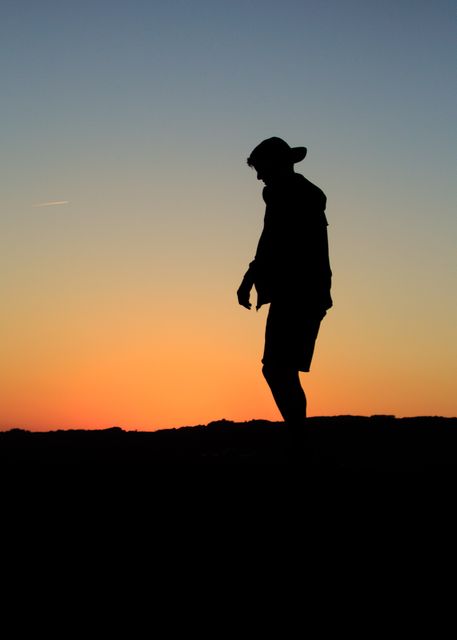 Silhouette of Person Walking Outdoors During Sunset - Download Free Stock Photos Pikwizard.com