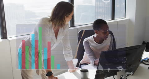 Diverse Colleagues Analyzing Data in Modern Office Environment