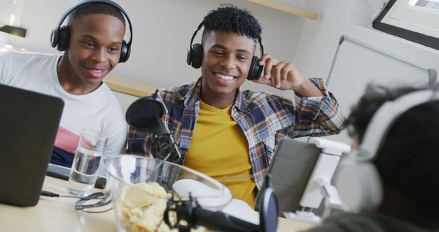 Teenage Friends Creating Podcast with Headphones and Microphones in Home Studio - Download Free Stock Images Pikwizard.com