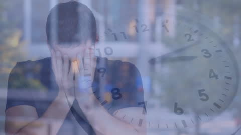 Frustrated Man and Clock Representing Stress and Time Pressure