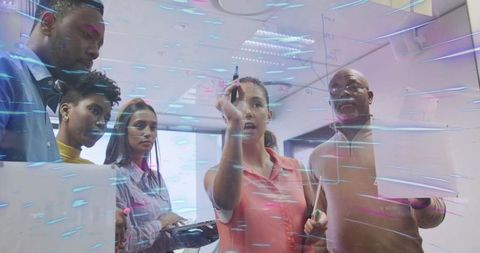 Diverse Team Collaborating on Futuristic Project in Modern Office