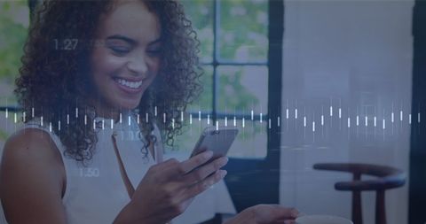 Smiling Woman Engaging with Financial Data on Smartphone - Download Free Stock Images Pikwizard.com