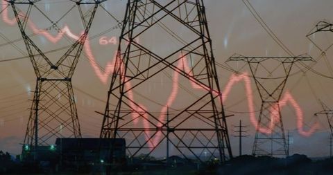 Dominating high-voltage transmission towers at dusk showing red energy wave overlay