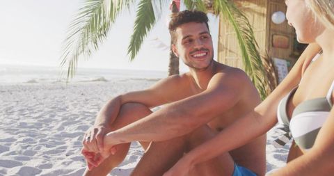 Couple Enjoying Sunny Day at Tropical Beach