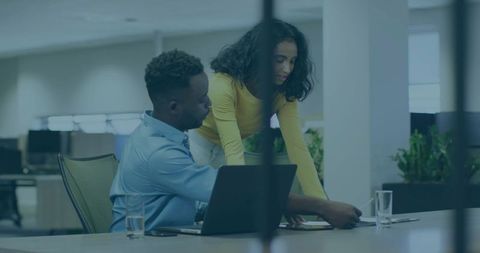 Team Collaborating Over Documents in Contemporary Office