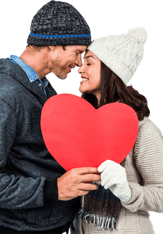 Festive Couple in Winter Attire Holding Heart Prop Transparent Background