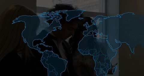 Business team analyzing global data with interactive world map overlay on tablet