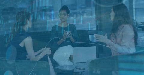 Collaboration of Diverse Businesswomen with Financial Data Overlay in Office