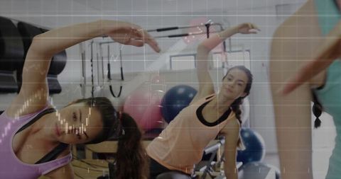 Women Practicing Pilates in Gym for Flexibility and Fitness