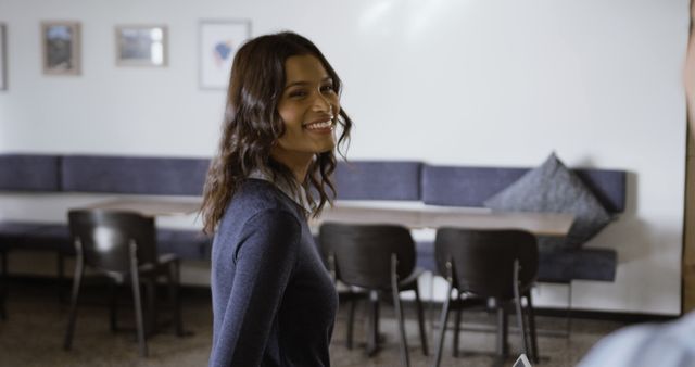 Smiling Woman Walking in Office Break Room - Download Free Stock Images Pikwizard.com