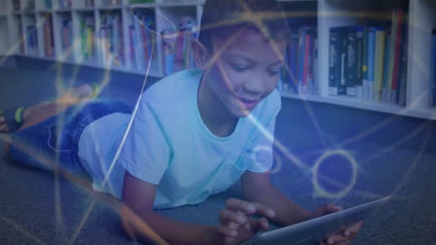 Happy Boy Engaging with Tablet Amid Digital Network Overlay