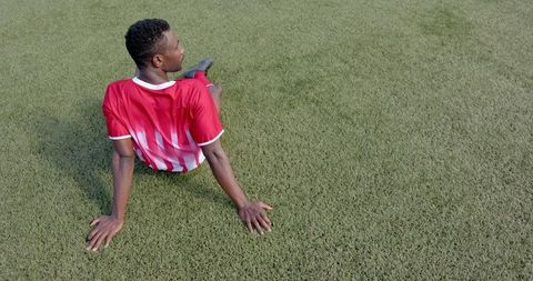 Resting Soccer Player on Turf Field