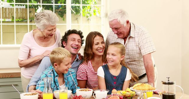 Multi-generational Family Enjoying Breakfast Together in Bright Kitchen - Download Free Stock Images Pikwizard.com