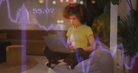 Creative professional woman analyzing data on laptop