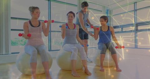 Group Fitness Training with Bicep Curls on Stability Balls