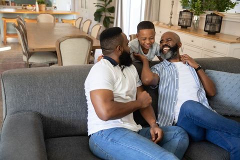 Joyful African American Family Bonding in Cozy Living Room