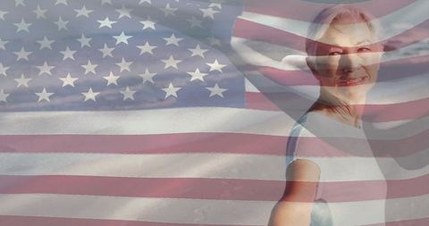 Smiling mature woman celebrating patriotism with American flag overlay and copy space