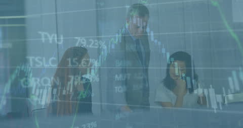 Business Team Analyzing Financial Graphs and Data in Modern Office