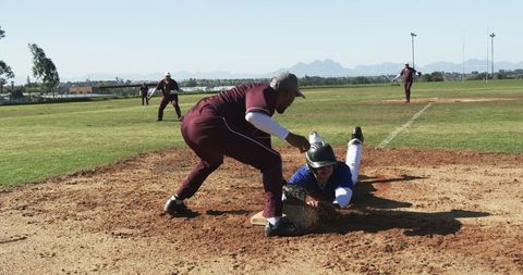 Intense Baseball Action Runner Sliding to Base