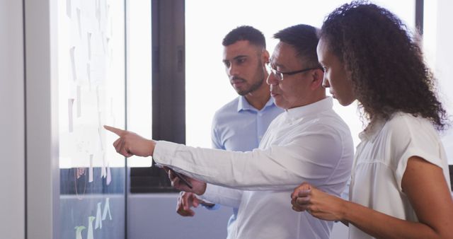 Business Team Collaborating on Project Strategy at Office Whiteboard - Download Free Stock Images Pikwizard.com