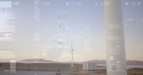 Wind farm with digital data concept overlays at dusk