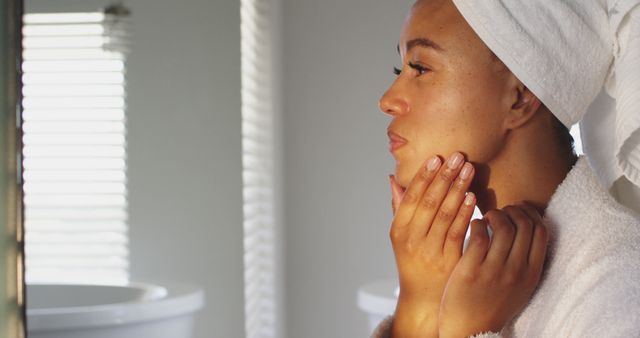 Woman Applying Skincare Routine After Shower in Bathroom - Download Free Stock Images Pikwizard.com