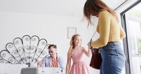Family Packing Luggage for Summer Trip at Home