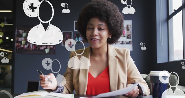 Smiling businesswoman working with medical symbols in modern office - Download Free Stock Images Pikwizard.com