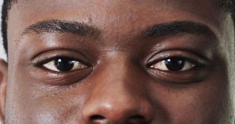 Close-Up of Focused African American Eyes, Confidence and Emotion