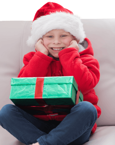 Joyful Boy with Santa Hat and Christmas Gift, Transparent Background