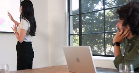 Business Professionals Collaborating in Modern Meeting Room