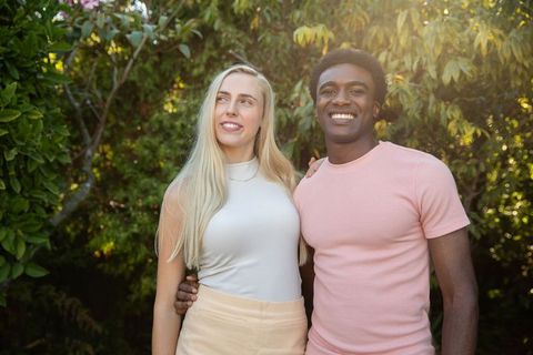 Diverse Couple Enjoying Peaceful Moment in Sunlit Garden