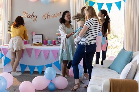 Diverse Friends Celebrating Baby Shower in Cozy Living Room