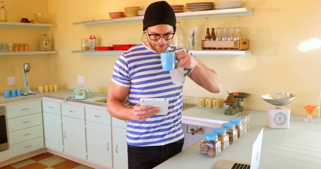 Modern Man Using Tablet And Laptop In Cozy Kitchen - Download Free Stock Images Pikwizard.com