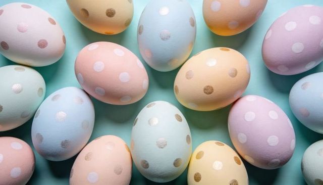 Displaying pastel polka dot easter eggs on turquoise background with gold metallic accents
